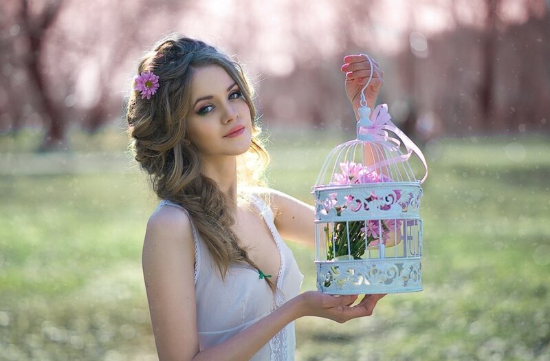 Woman Holding Birdcage — White, Serene, Spring