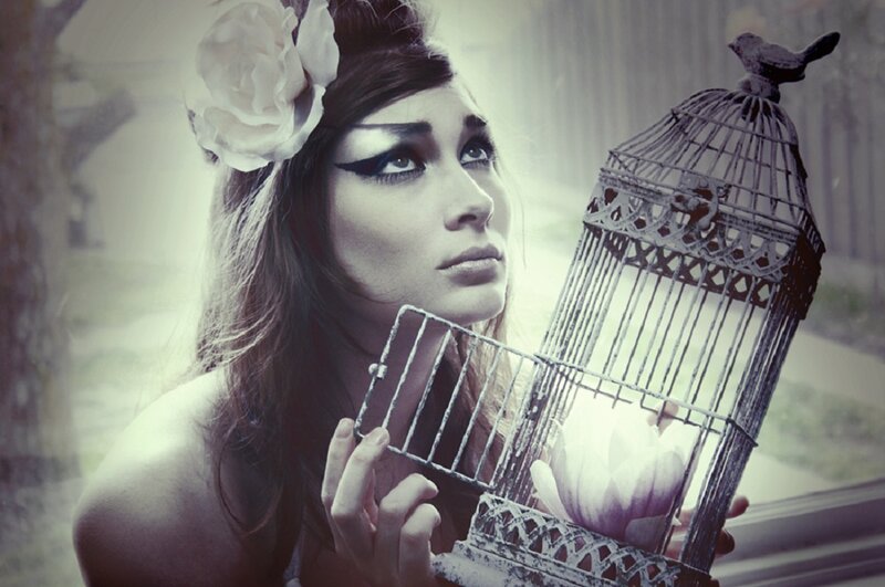 Woman Holding Birdcage — White