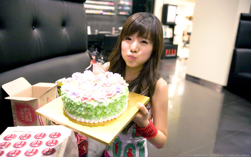 woman holding birthday cake