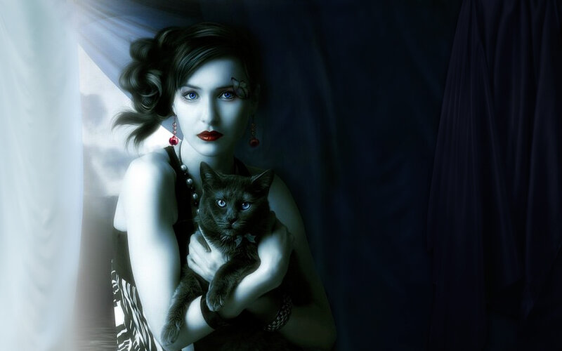woman holding black cat