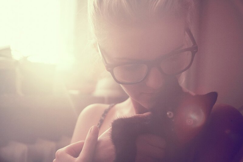 Woman Holding Black Cat — Pink