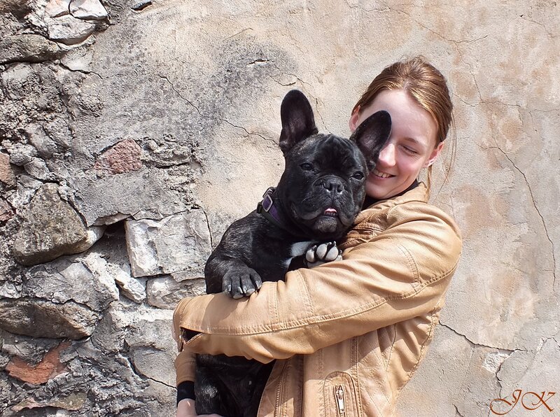 Woman Holding Black Dog