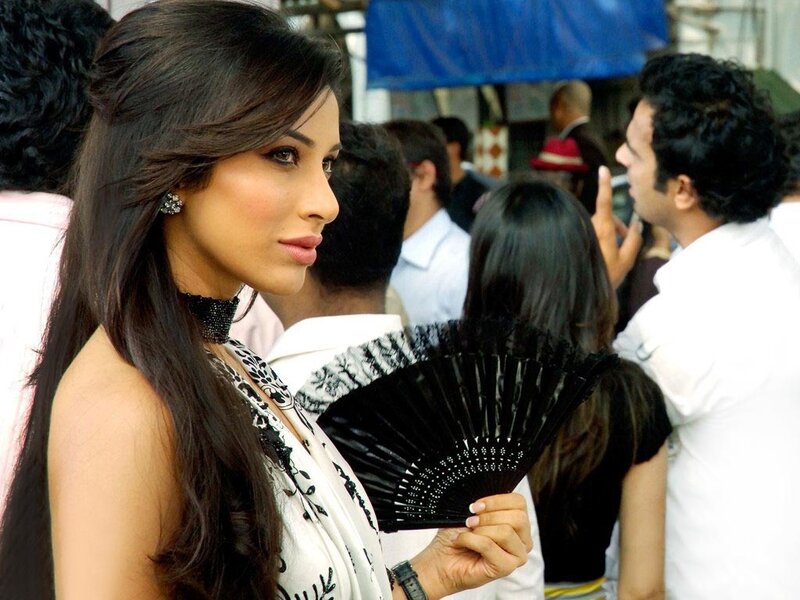 woman holding black fan