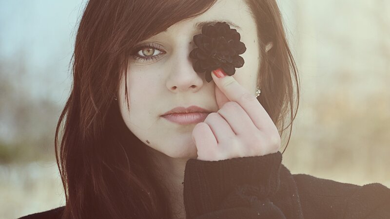 Woman Holding Black Flower
