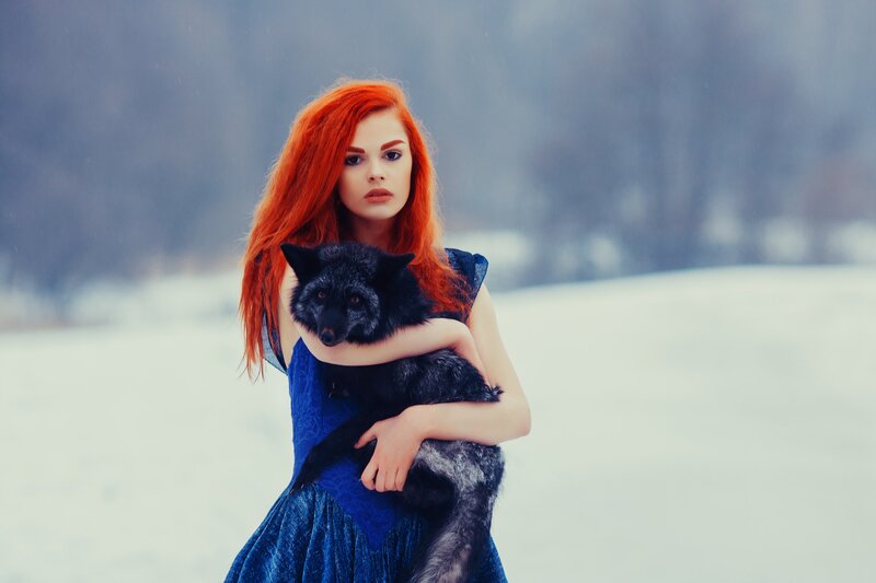 Woman Holding Black Fox