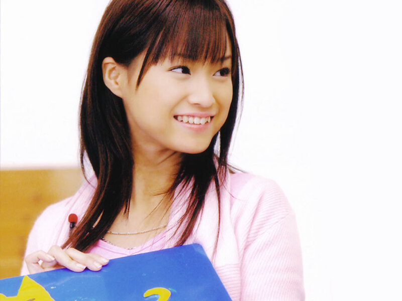woman holding blue folder
