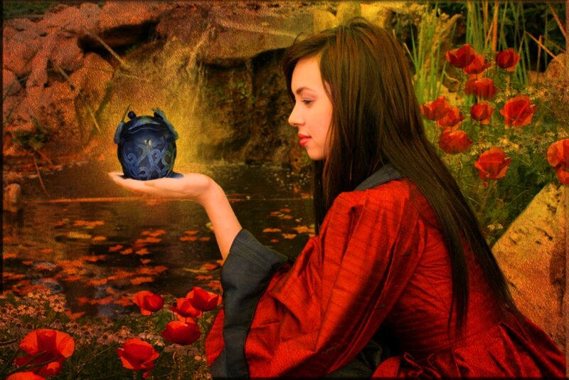 Woman Holding Blue Orb
