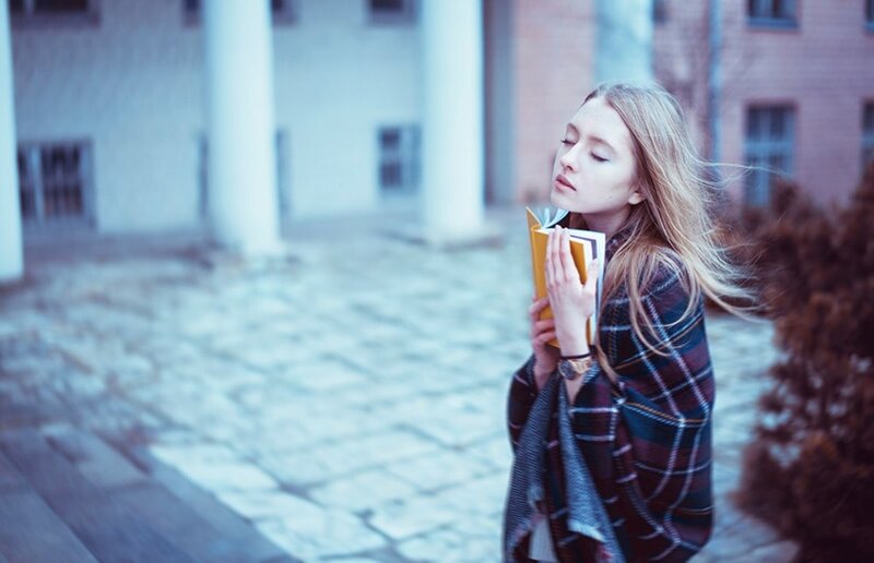 Woman Holding Book — Blue, Calm