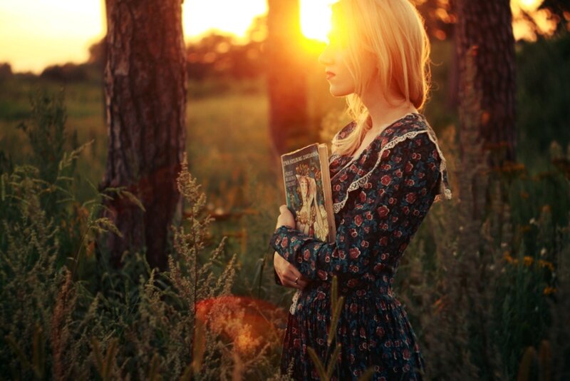 Woman Holding Book — Gold