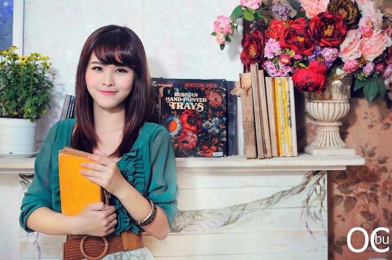 woman holding book in cozy setting