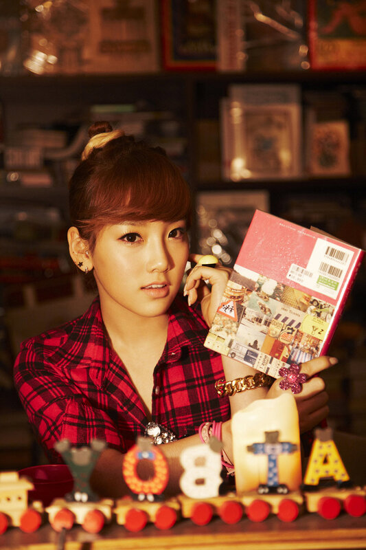 woman holding book in toy store