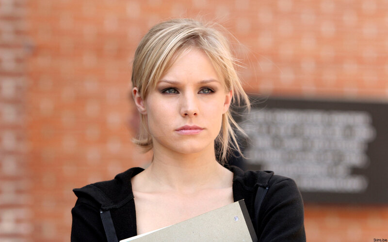 woman holding book outside