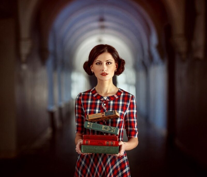 Woman Holding Books — Red