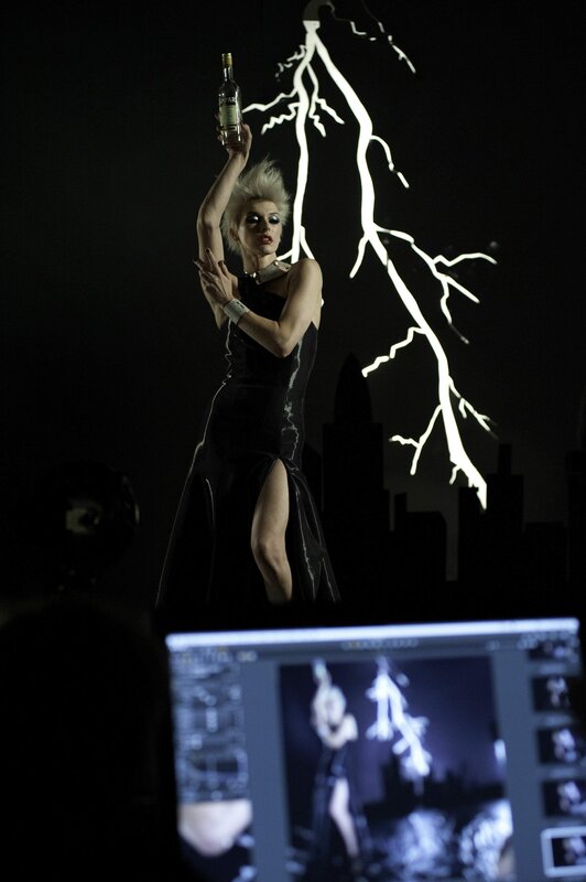 woman holding bottle on stage