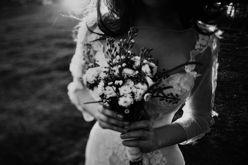 Woman Holding Bouquet — Black, Dramatic