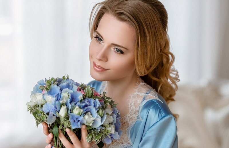 Woman Holding Bouquet — Blue, Serene