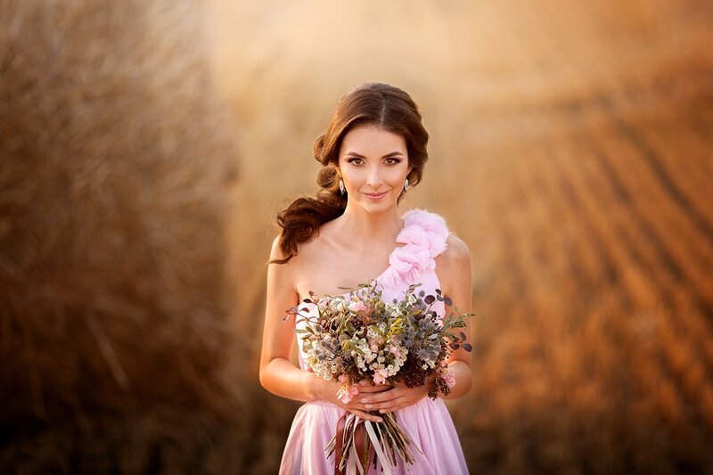 Woman Holding Bouquet — Pink, Serene, Sunset, Photograph