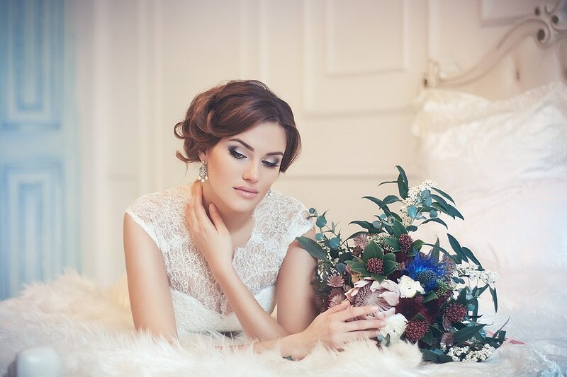 Woman Holding Bouquet — White, Serene, Photograph, Bed