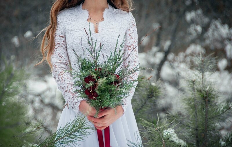 Woman Holding Bouquet — White, Serene, Winter, Photograph, Pine Branches