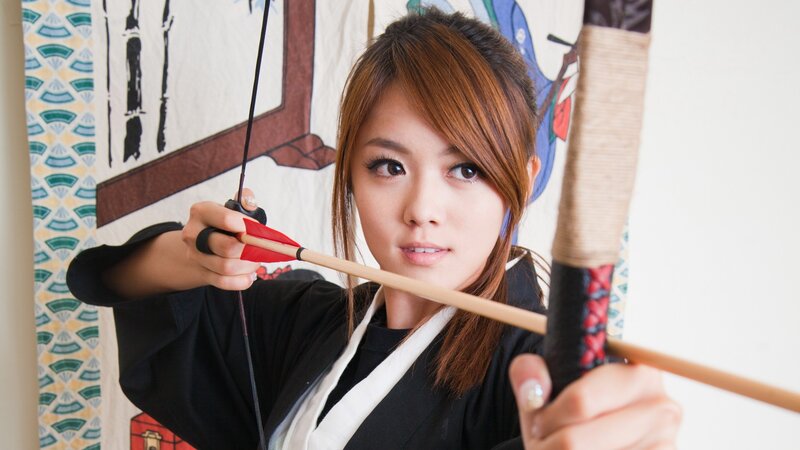woman holding bow and arrow