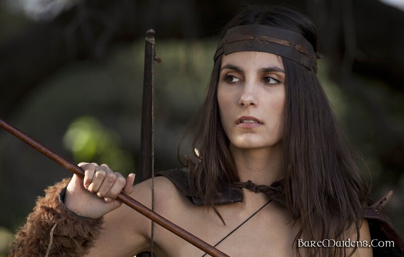 woman holding bow and arrow
