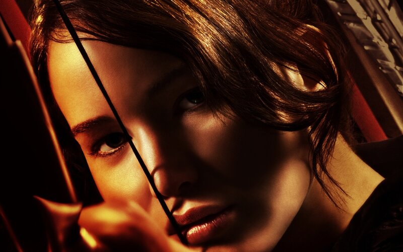 Woman Holding Bow — Brown, Dramatic, Photograph