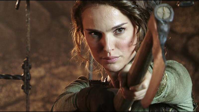Woman Holding Bow — Brown, Intense