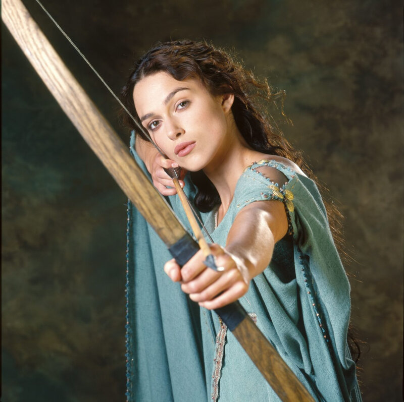 Woman Holding Bow — Green, Focused