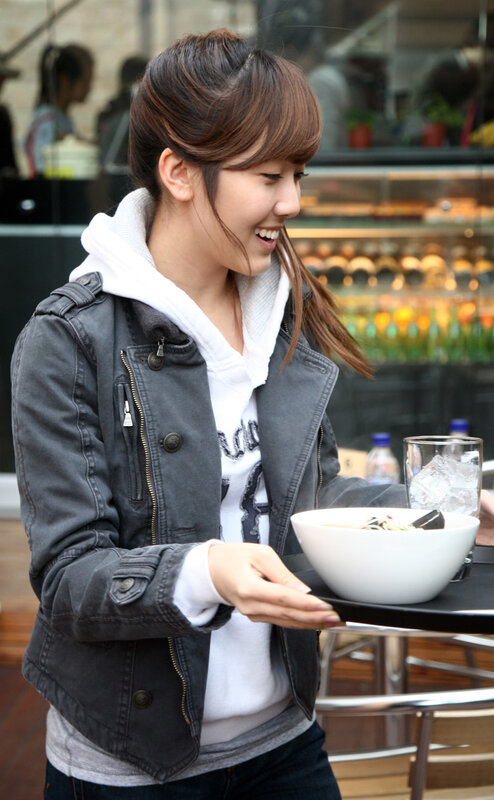 woman holding bowl of food