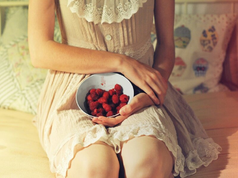 Woman Holding Bowl of Raspberries — Beige