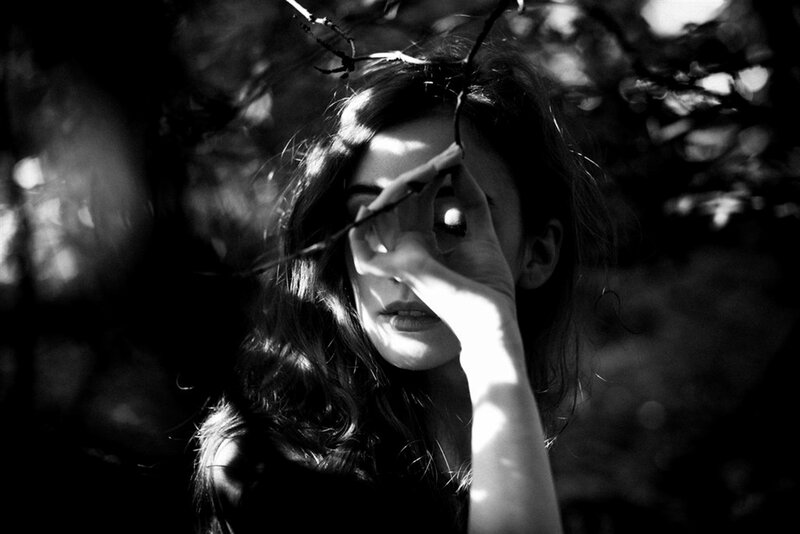 Woman Holding Branch — Black