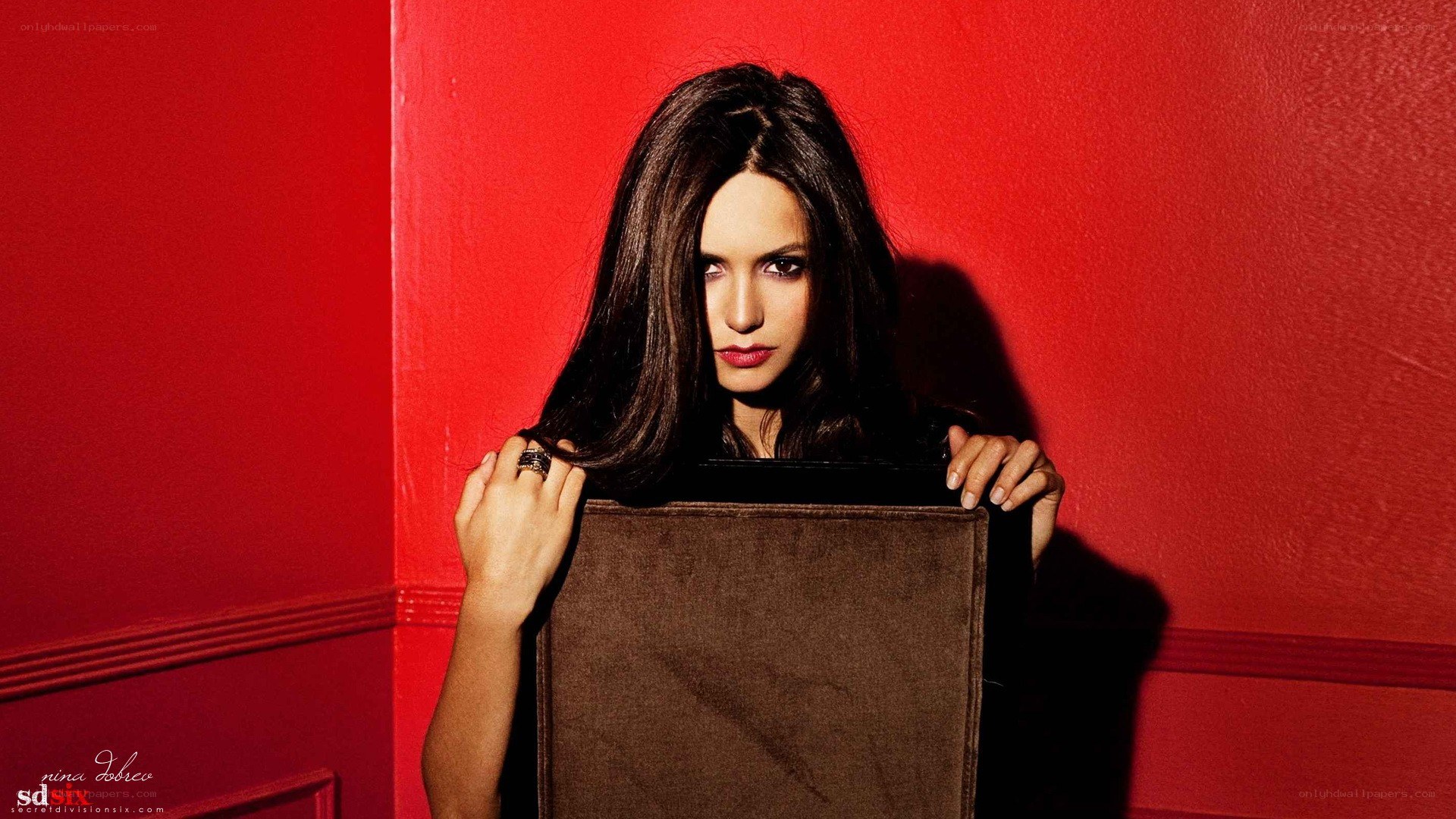 woman holding brown box