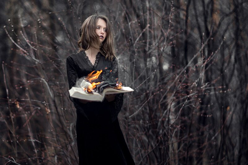 Woman Holding Burning Book — Black
