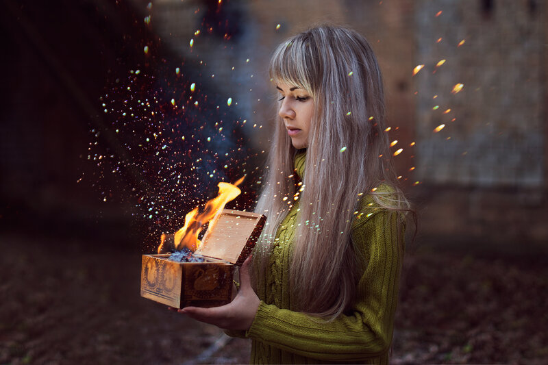 Woman Holding Burning Box