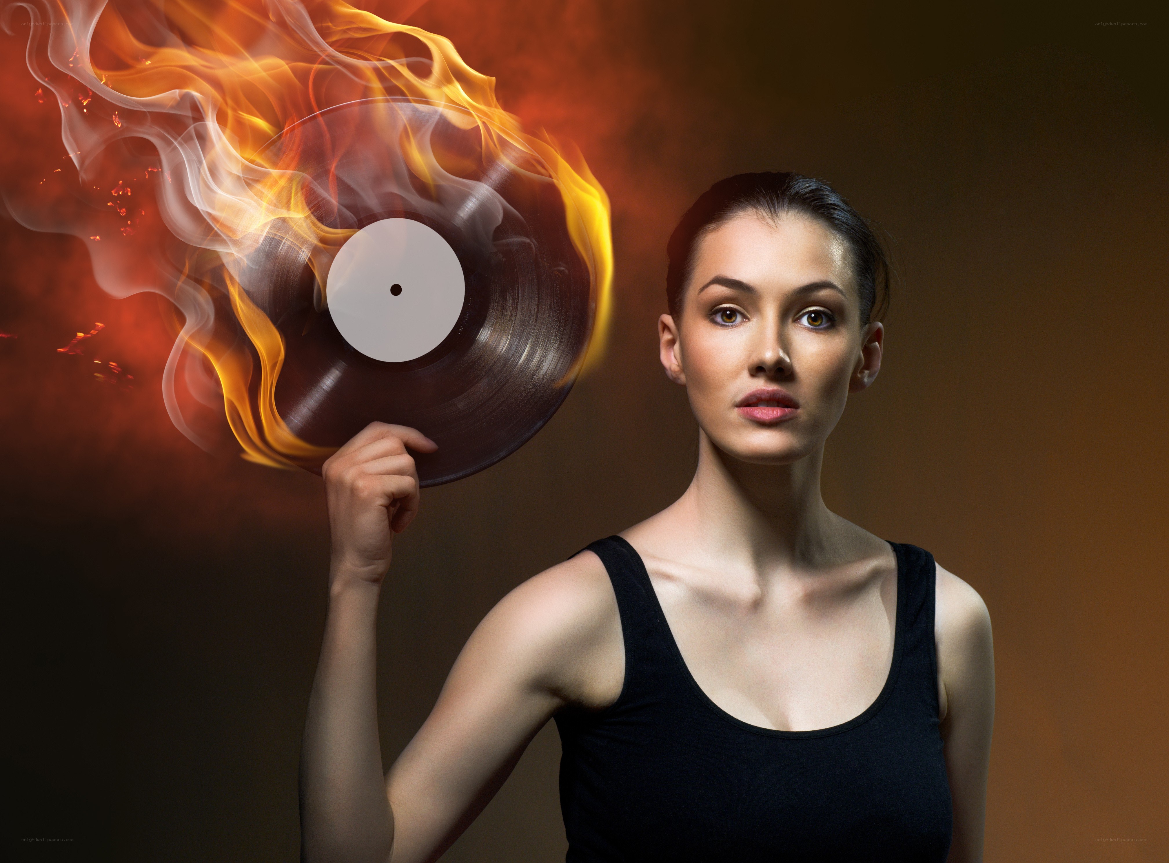 woman holding burning record