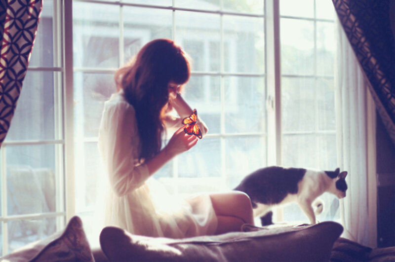 Woman Holding Butterfly
