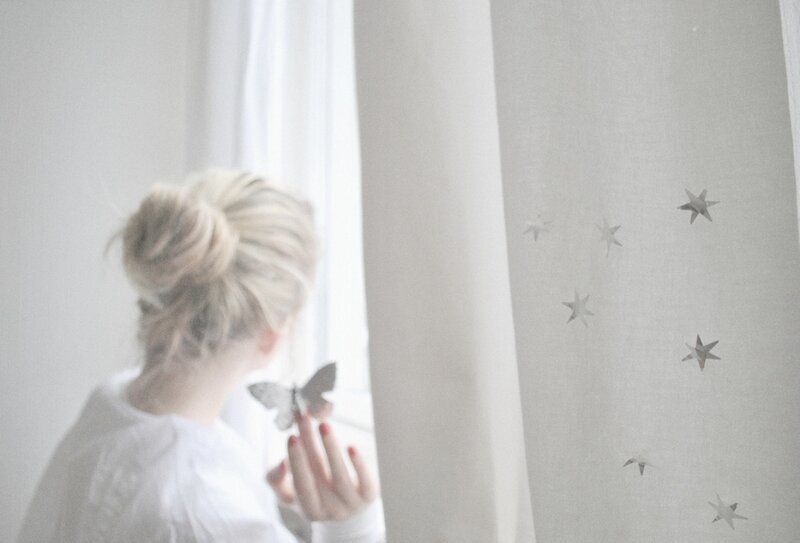 Woman Holding Butterfly — White