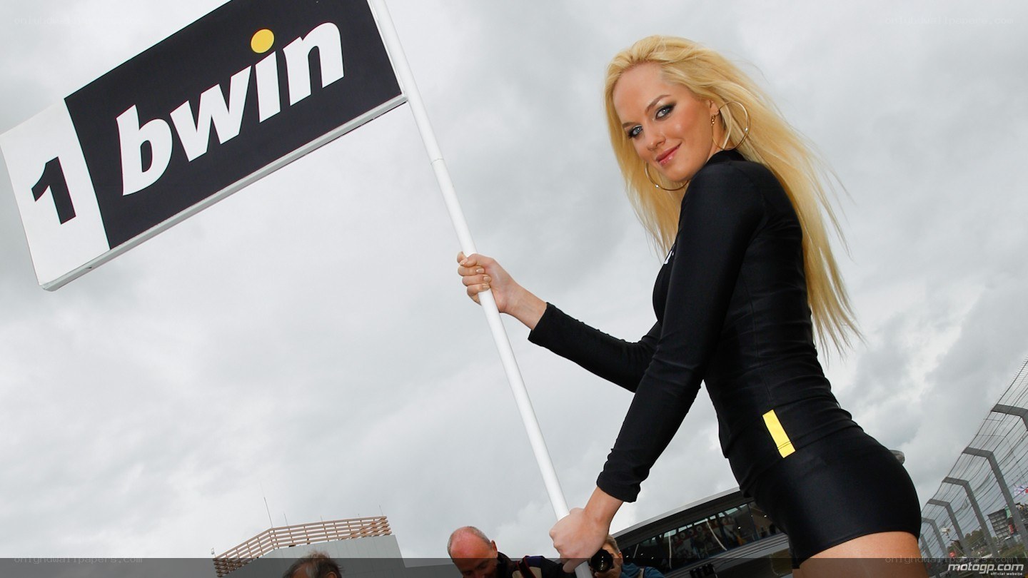 Woman holding bwin sign