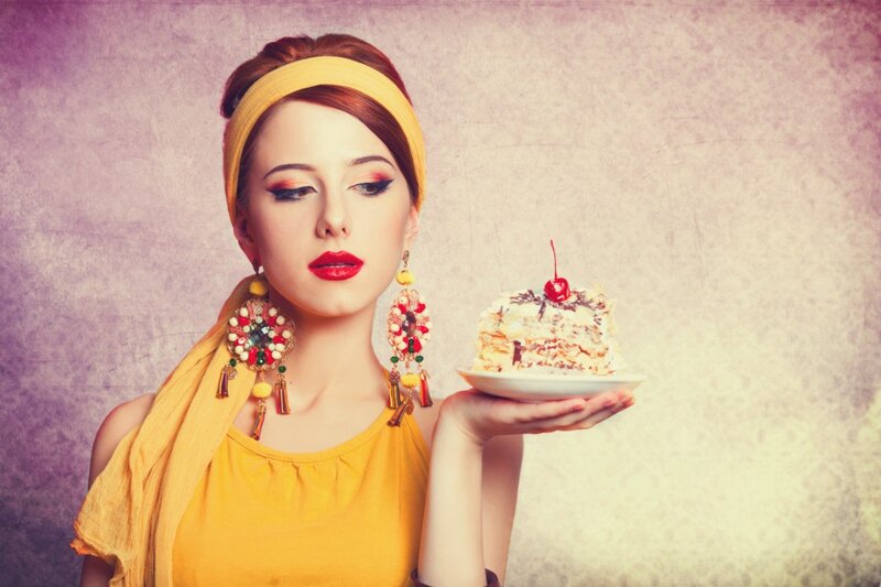 Woman Holding Cake — Yellow