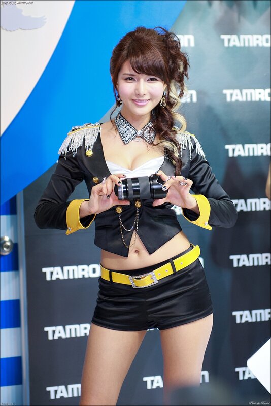 Woman holding camera at event