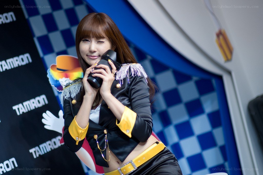 Woman holding camera at event