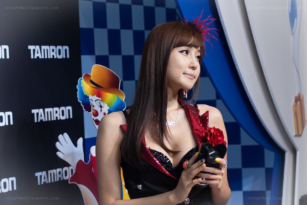 Woman holding camera at event