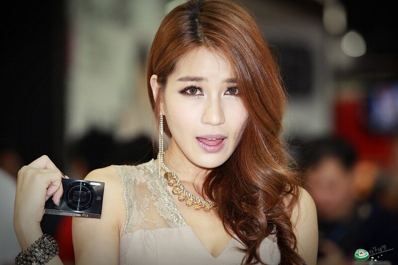 woman holding camera at event