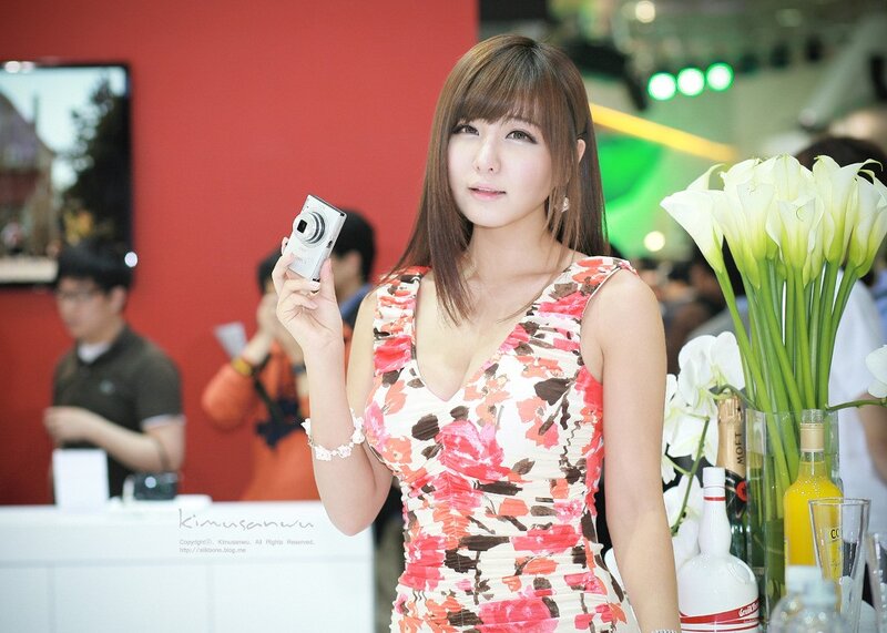Woman holding camera at event