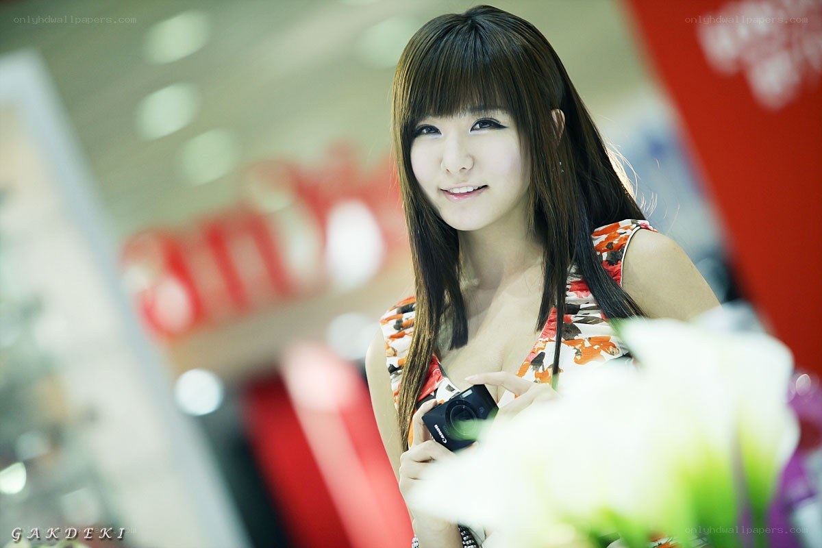 woman holding camera at event