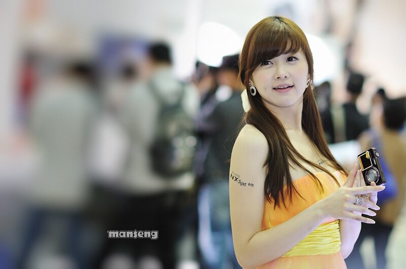 woman holding camera at event