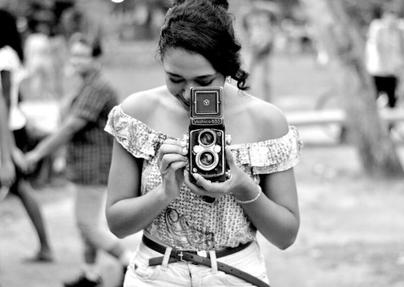 Woman Holding Camera — Black, Calm, Afternoon