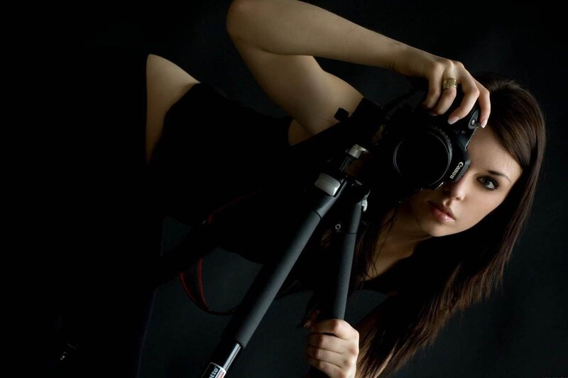 Woman Holding Camera — Black, Dramatic