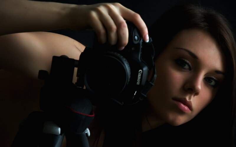 Woman Holding Camera — Black