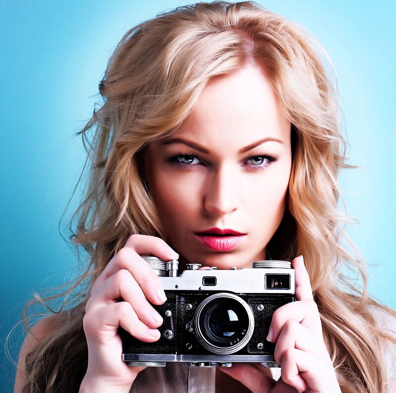 Woman Holding Camera — Blue, Direct
